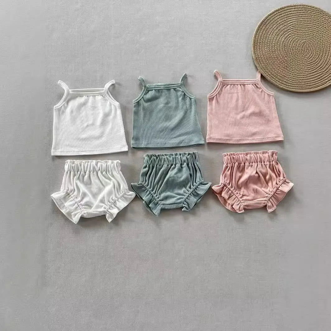 Women's cotton rib home wear two-piece set with sleeveless top and shorts in rose colour on white background