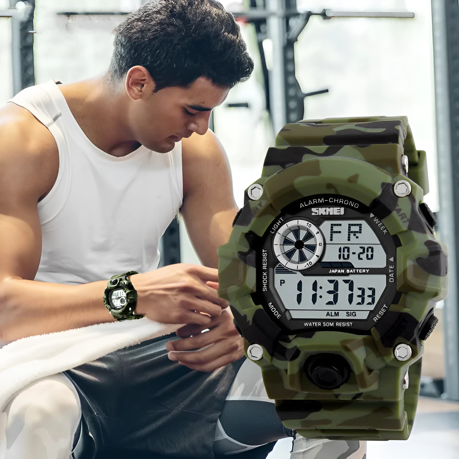 Electronic sports watch with round dial showing GMT display, available in five colours including camouflage green