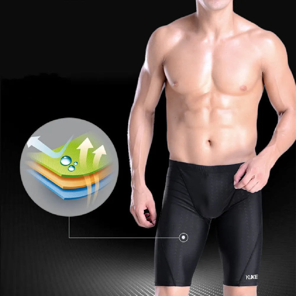 Men's black swim set with trunks, anti-fog goggles, waterproof cap, ear plugs with nose clip, and swimming bag