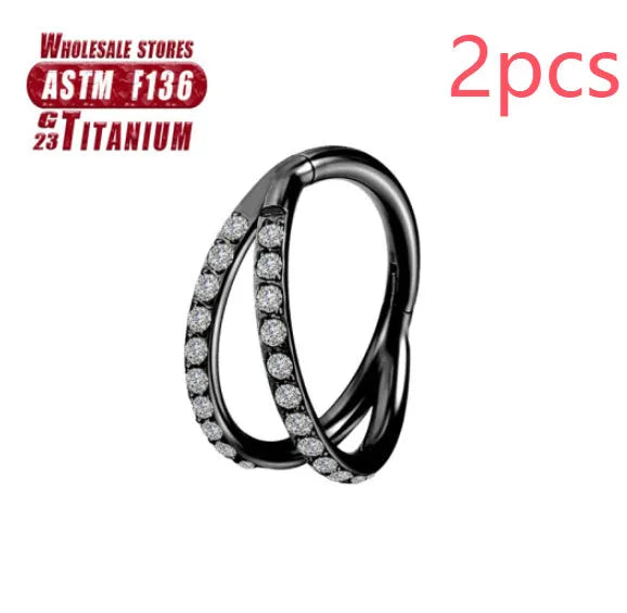 Close-up of a titanium alloy nose ring with a fork closure, shown in silver finish on a grey background.