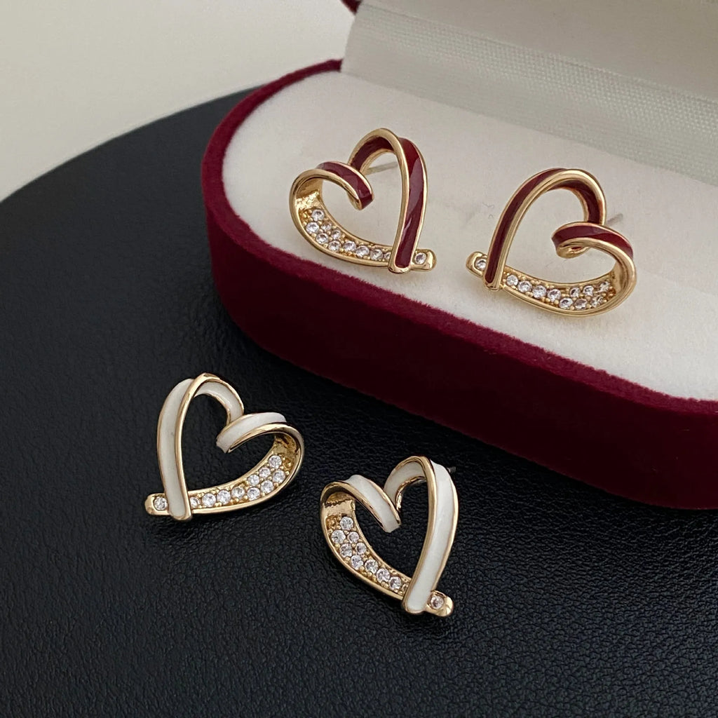 Micro-set zircon asymmetric heart earrings for women, copper base, white colour, ear clip style