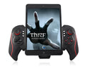 PG-9023 wireless telescopic game controller extended with phone in holder, showing thumbsticks and buttons