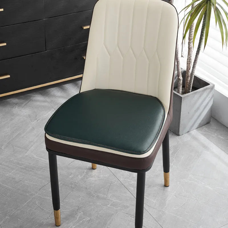 Leather horseshoe-shaped seat cushion in beige colour showing curved design and non-slip underside