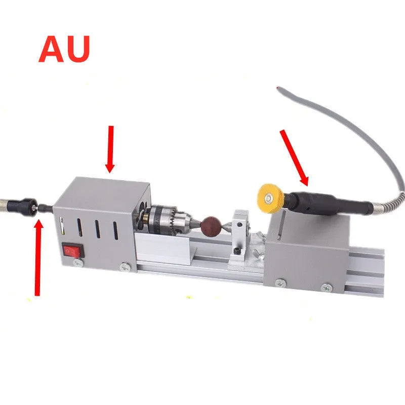 Compact metal mini woodworking lathe with carving knives on workbench