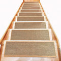 Japanese-style solid-colour linen-look stair mat with rubber backing lying flat on a wooden step.