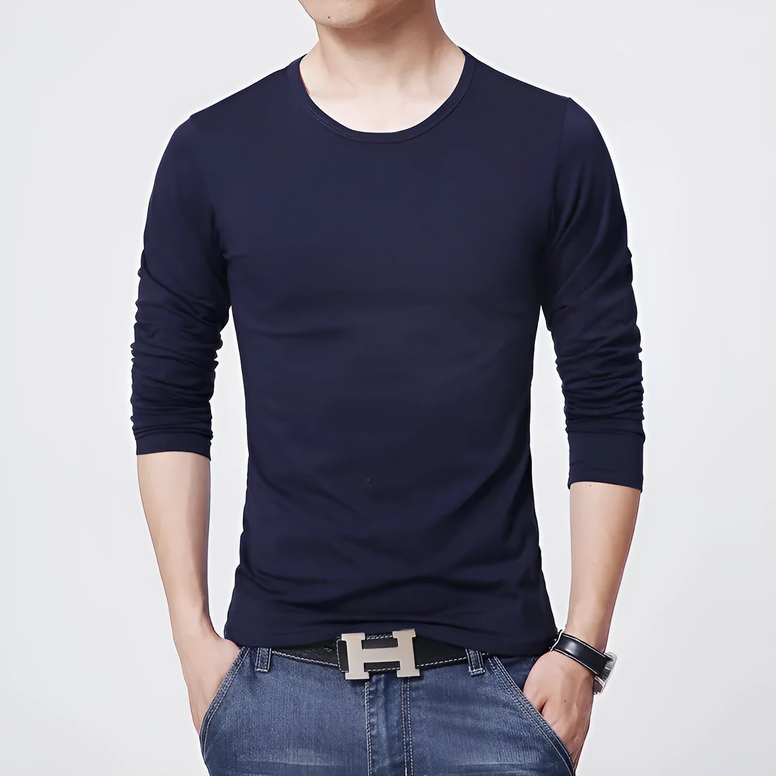 Young men's solid colour linen base shirt in black, sleeveless with striped pattern, worn as casual vest layering piece