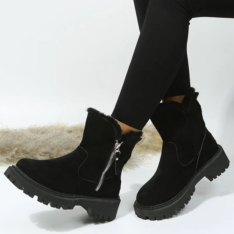 Women's black thick plush high top snow boots with side zipper and round toe on a rubber sole.