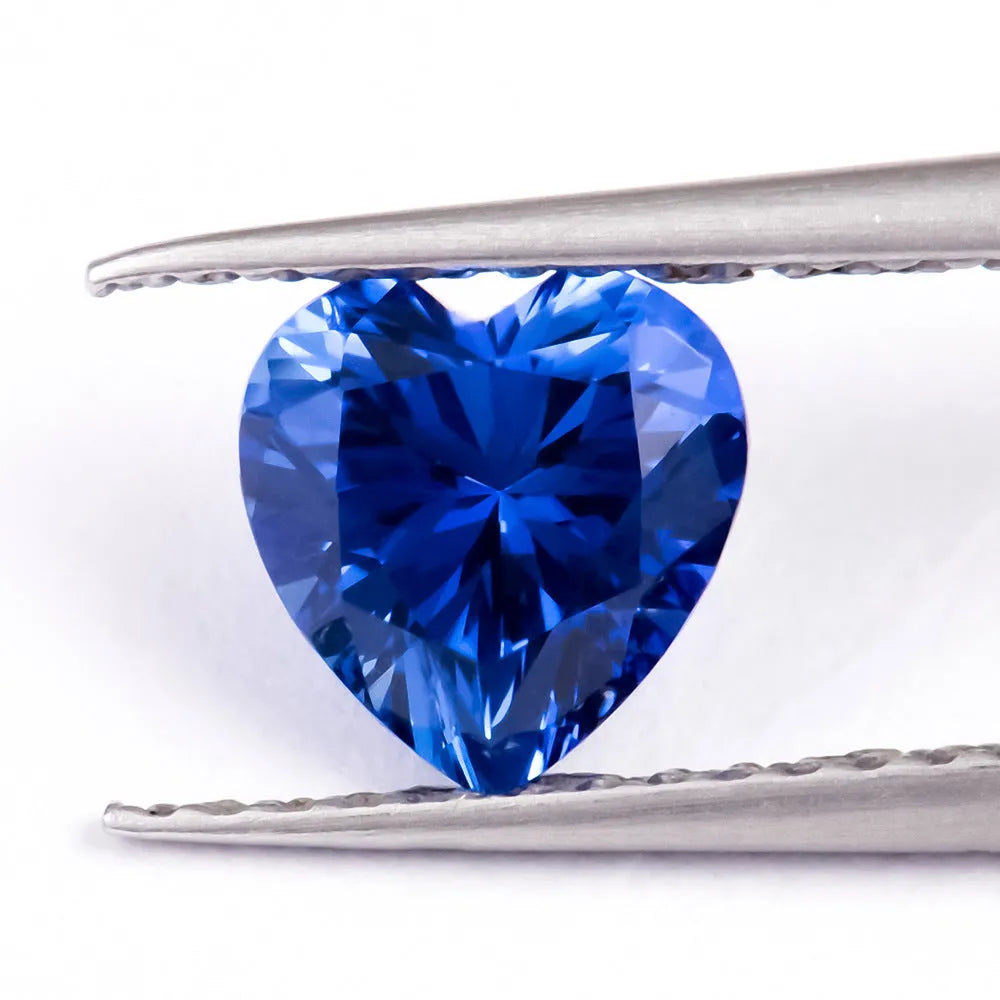 Royal blue heart-shaped tiara design cultivated gemstone on a white background