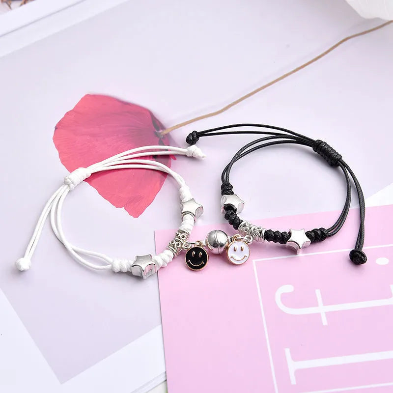 Magnetic clasp couple bracelets with alloy construction and symbolic designs including crown and love lock motifs.