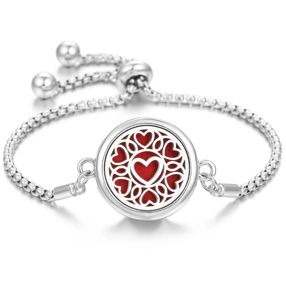 Hollow stainless steel adjustable aromatherapy bracelet with 20mm box diameter and electroplated alloy finish on white background