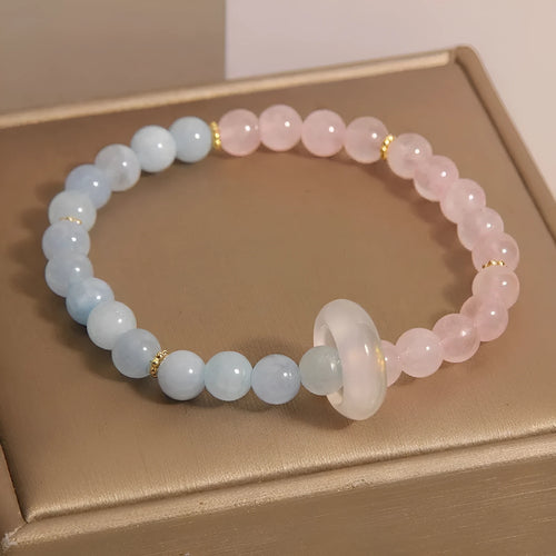 Women's aquamarine crystal bracelet with pink and blue dopamine colours, round geometric beads, handcrafted mixed materials