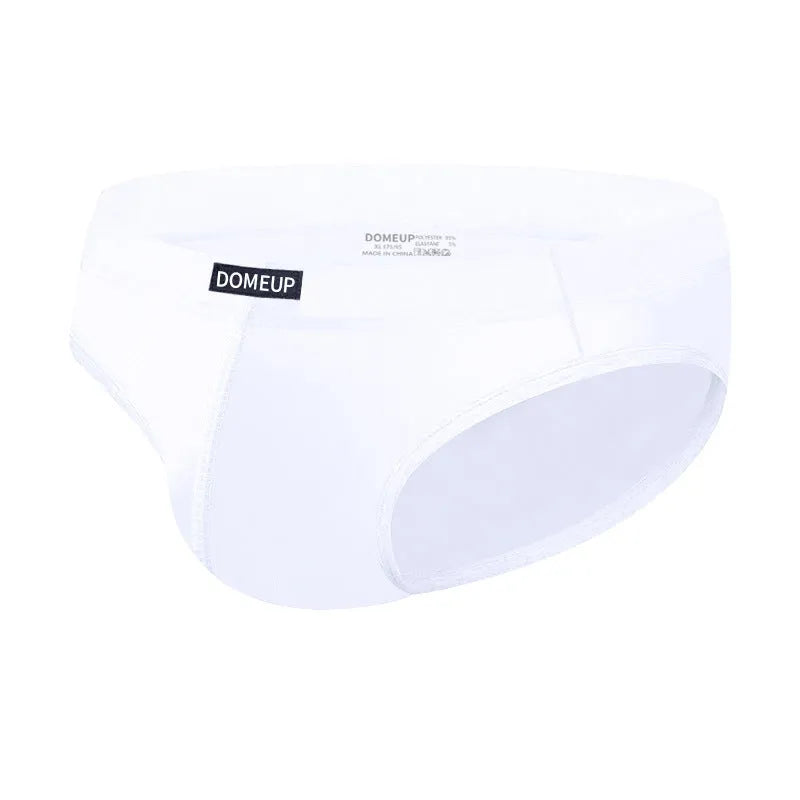 Men's seamless low waist briefs in black, white, or pink with hip-lifting function