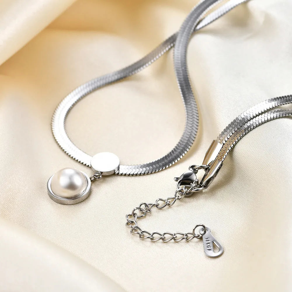 8mm flat snake blade necklace in titanium steel with geometric round element, available in steel colour