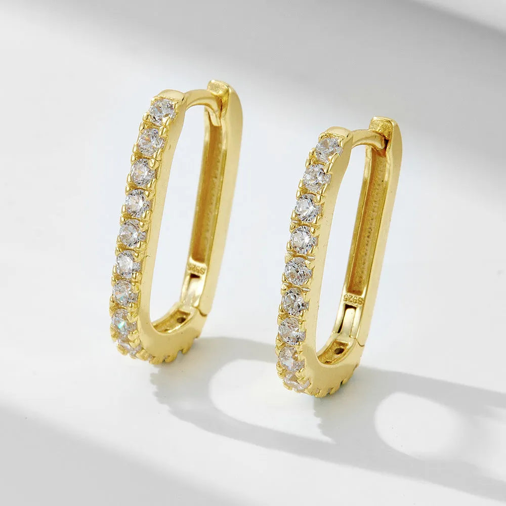 Sterling silver oval zircon ear clips with geometric design in white or yellow finish