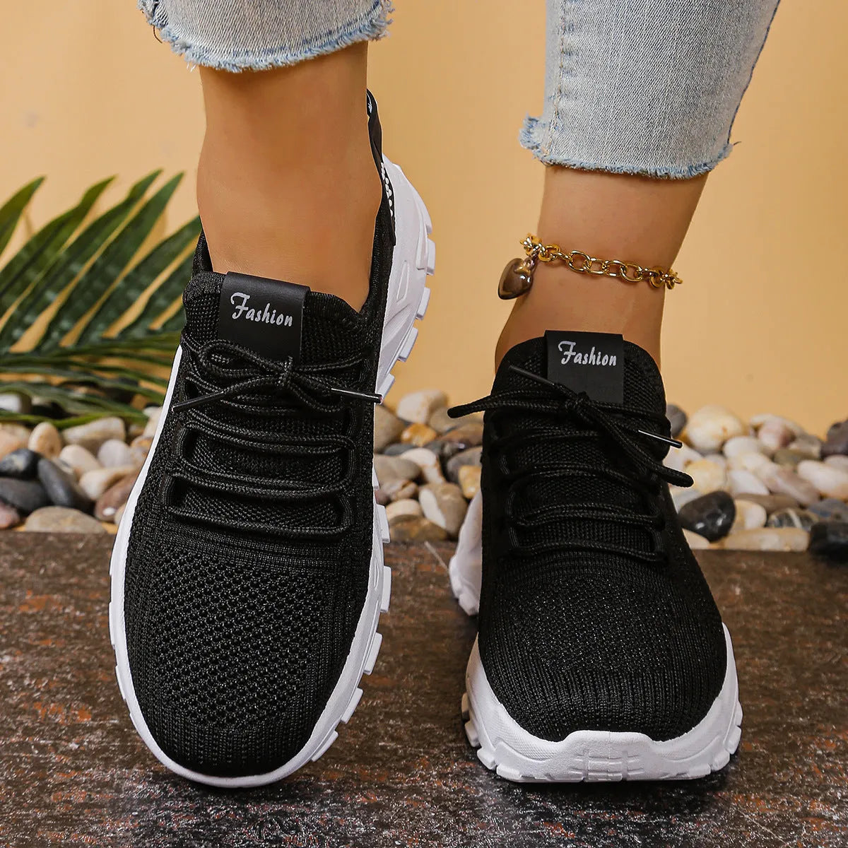 Women's low-top sports shoes with mesh upper and white sole in multiple colours.