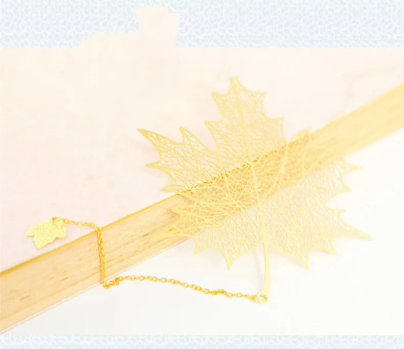 Brass bookmark with hollow-cut leaf design and matching rose gold metal tassel