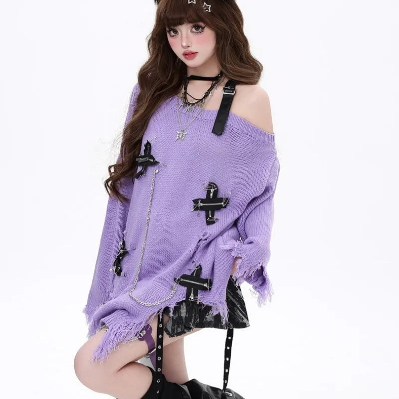 Women's off-the-shoulder loose fit sweater with ripped detailing and tassel trim in black, on model