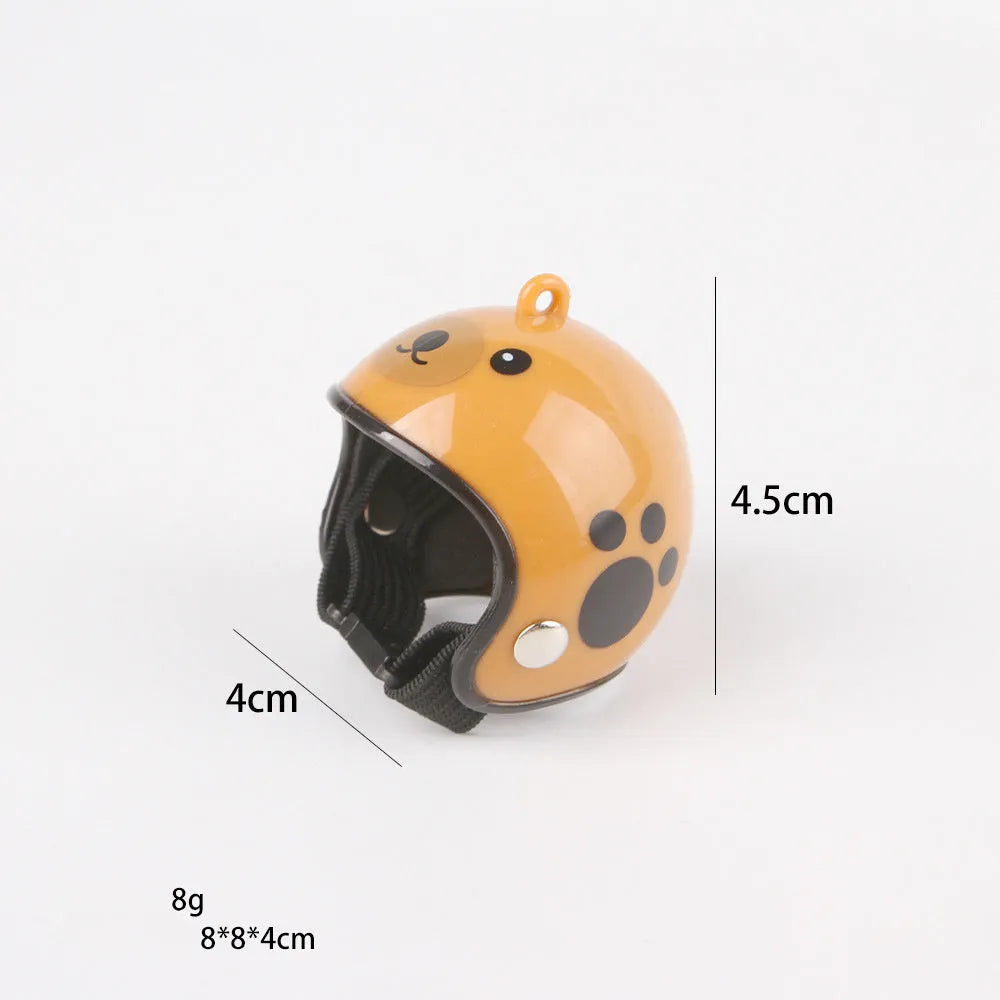 Small adjustable plastic safety helmet for a chicken or bird, shown in a fun design.