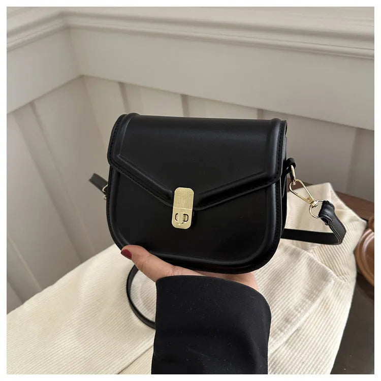 Soft PU leather clamshell messenger bag in horizontal square design shown in available colours.