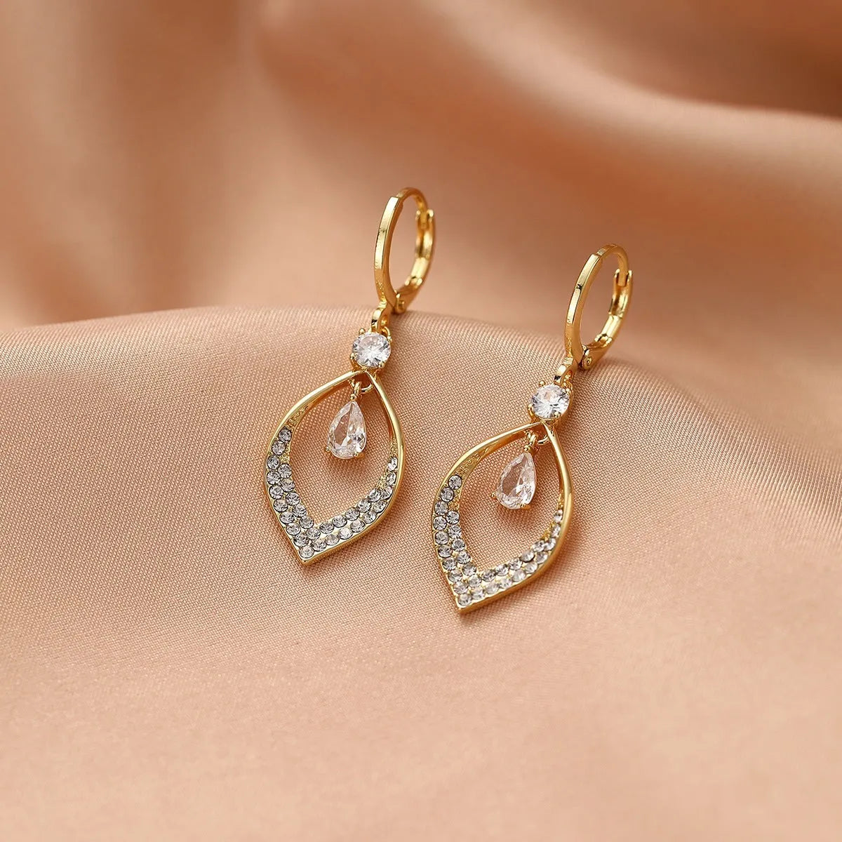 Gold and silver zircon teardrop tassel drop earrings on a copper base.