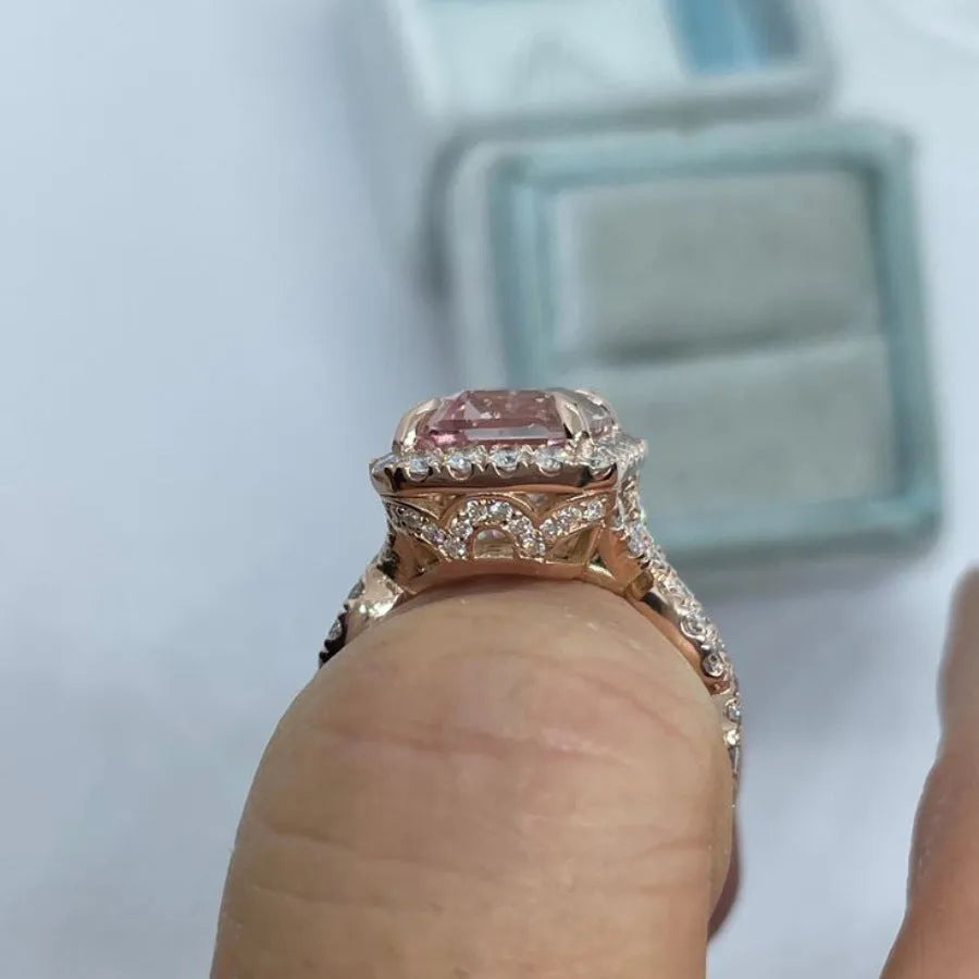 Rose gold electroplated alloy ring with geometric shape on white background