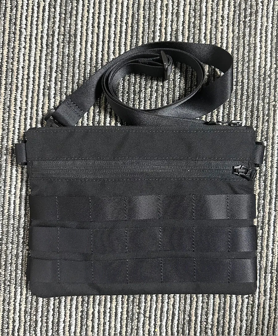 Black tactical waist pack made from Oxford cloth measuring 18cm by 3.5cm