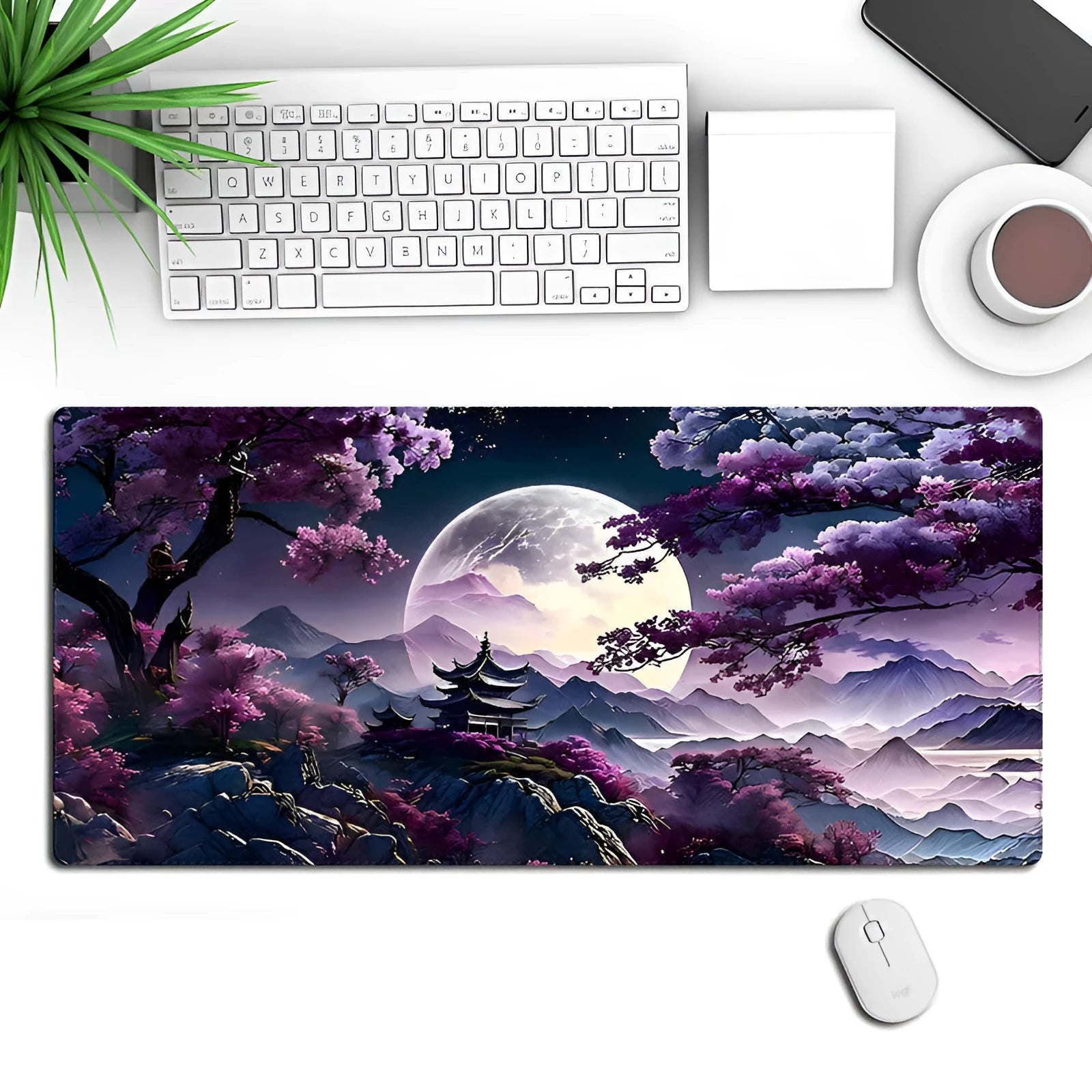 Large black gaming mouse pad with geometric pattern, shown on desk with keyboard and mouse