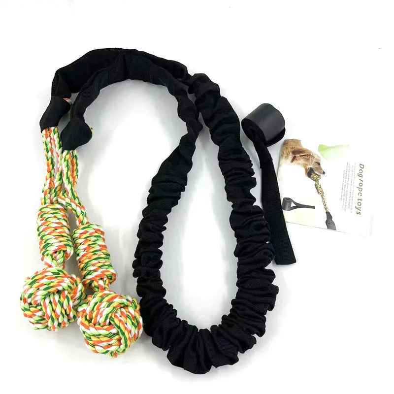 Cotton thread dog tug-of-war rope toy in red, shown with a dog during play.
