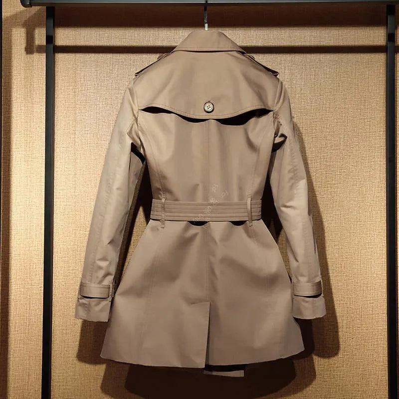 Khaki women's double-breasted trench coat with long sleeves and button fastenings.