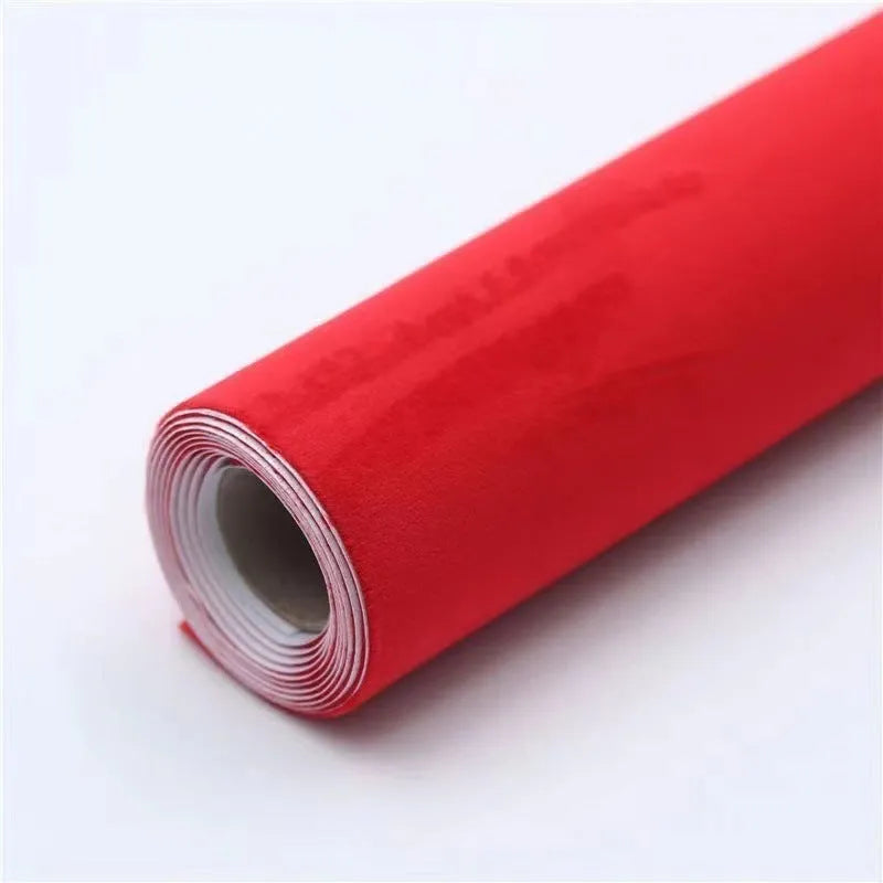 Rolls and sheets of coloured self-adhesive suede leather material for DIY projects.