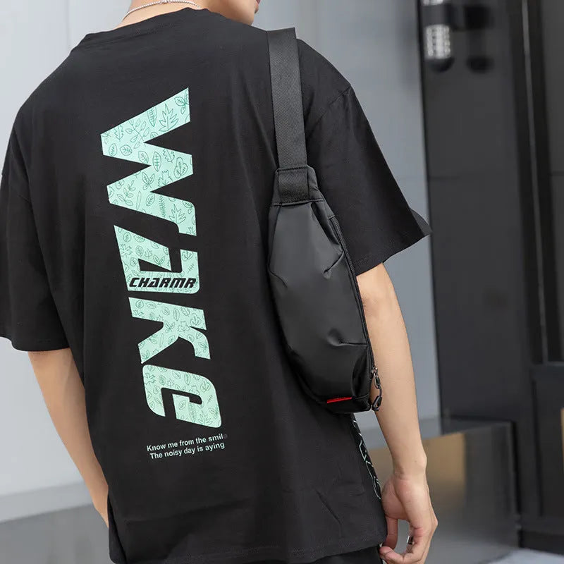 Black Oxford cloth men's crossbody waist pack showing internal phone and ID pockets