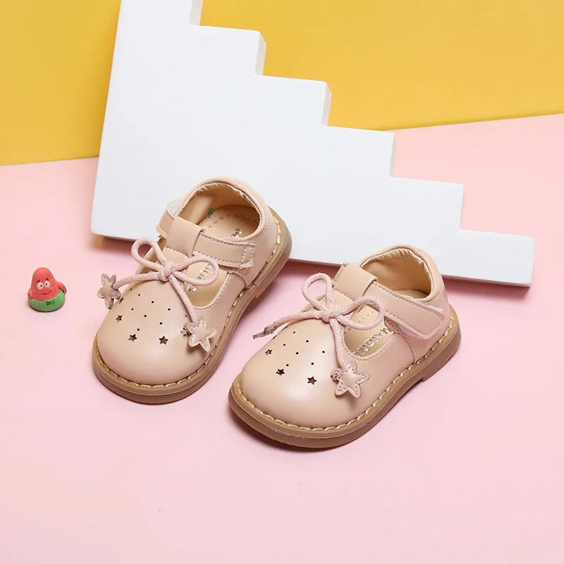 Infant toddler soft sole girls shoes in black microfiber leather, breathable design, side view