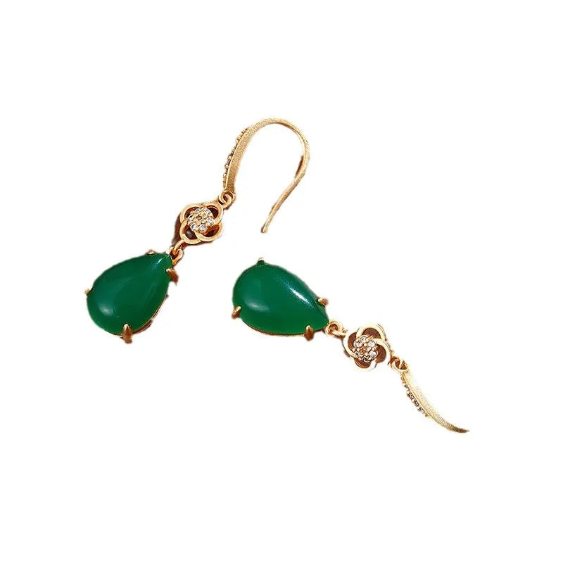 Gold-plated drop agate earrings on display showing alloy base and stone pendant