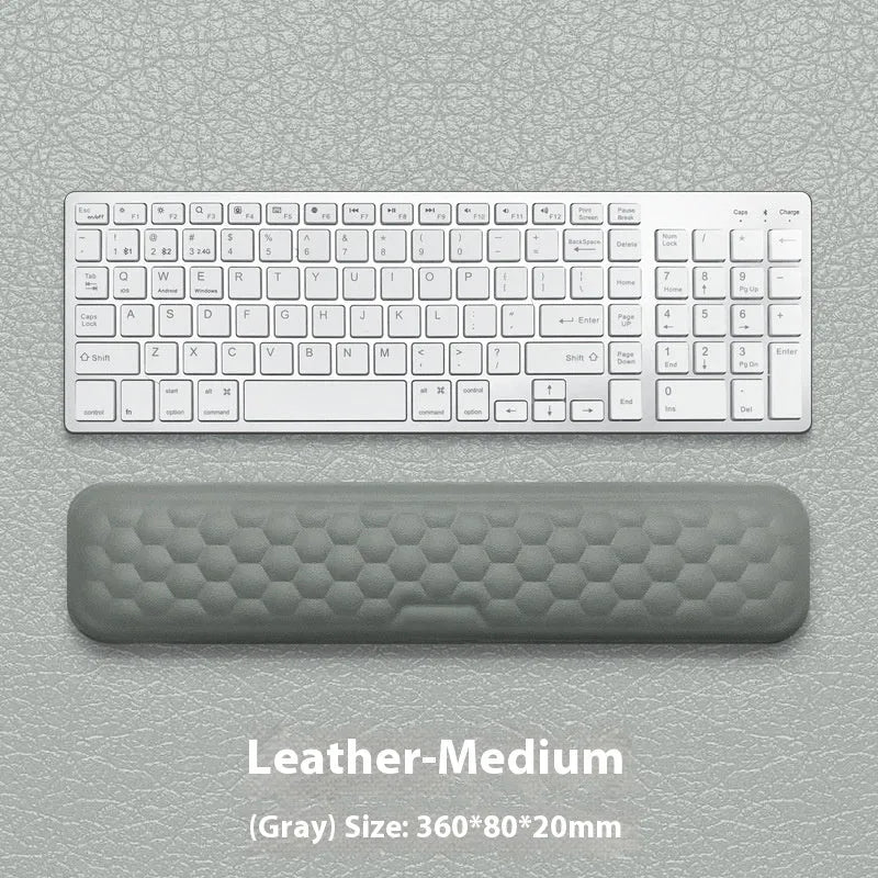 Memory foam mouse wrist rest with silicone base in black cloth and grey leather style options.