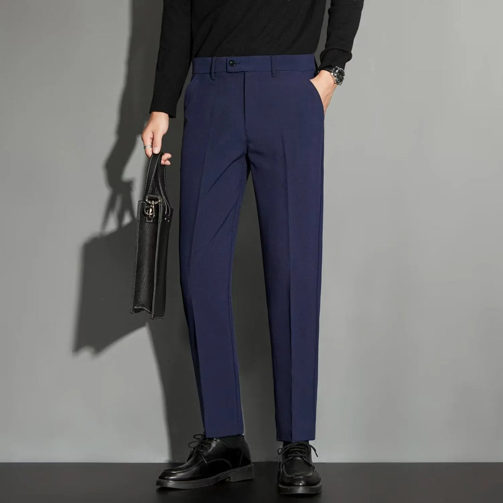 Men's straight leg ankle-length suit trousers in apricot colour on a model