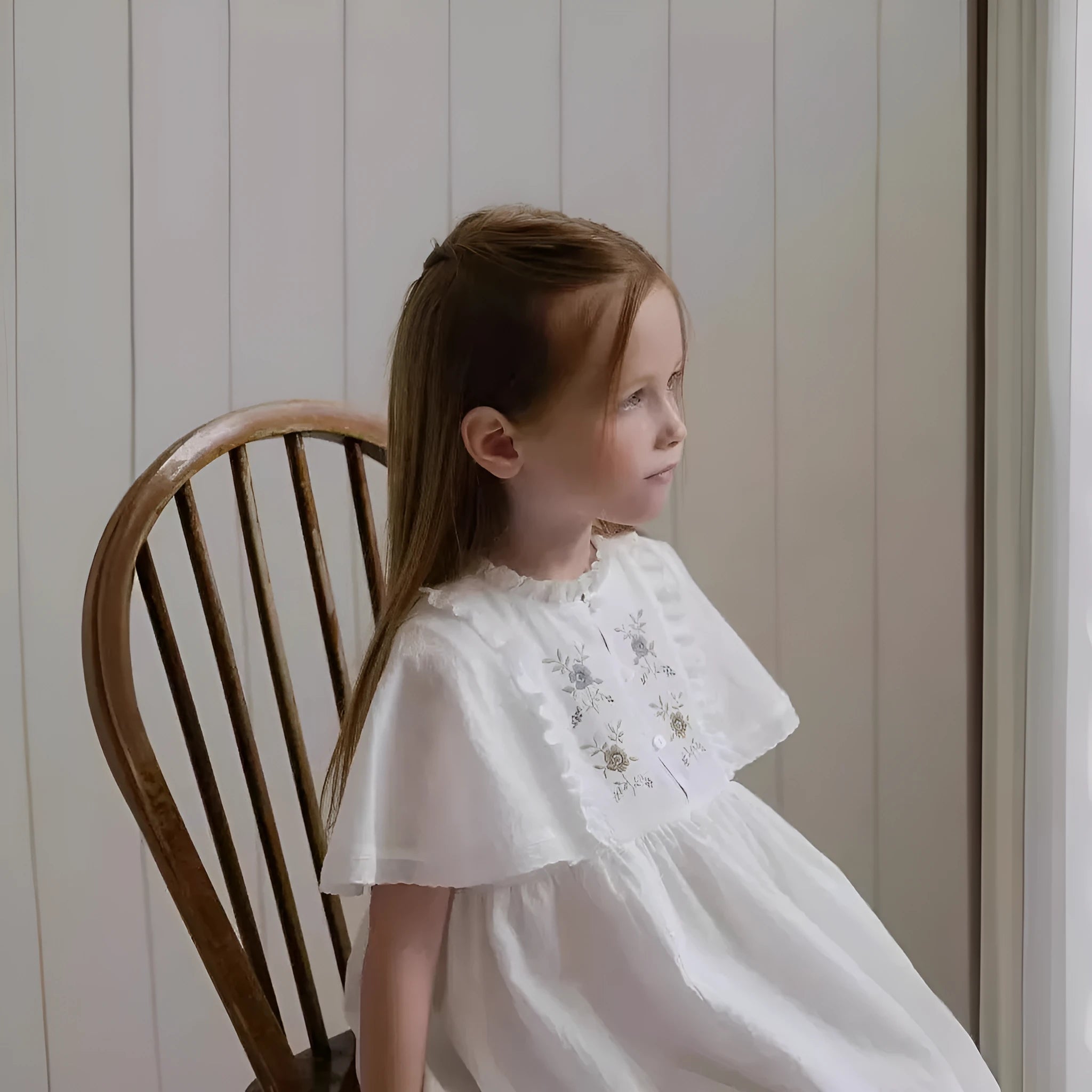 White washed cotton girls dress with short sleeves, ruffled and embroidered skirt for summer