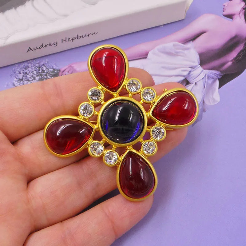 Medieval baroque crystal cross brooch in zinc alloy with ornate design on dark background