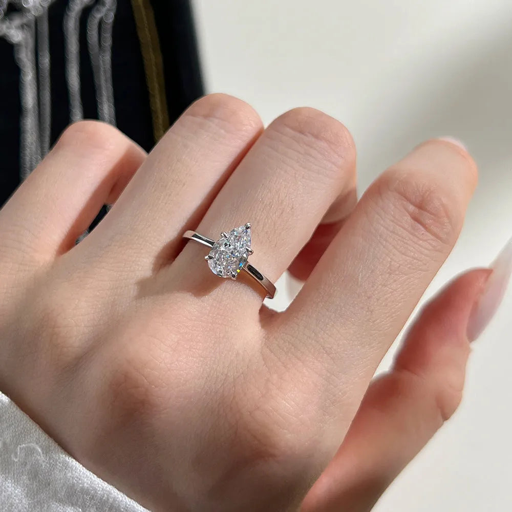 Sterling silver ring with pear-shaped high-grade zircon inlay, closed band, electroplated finish, multiple colours available
