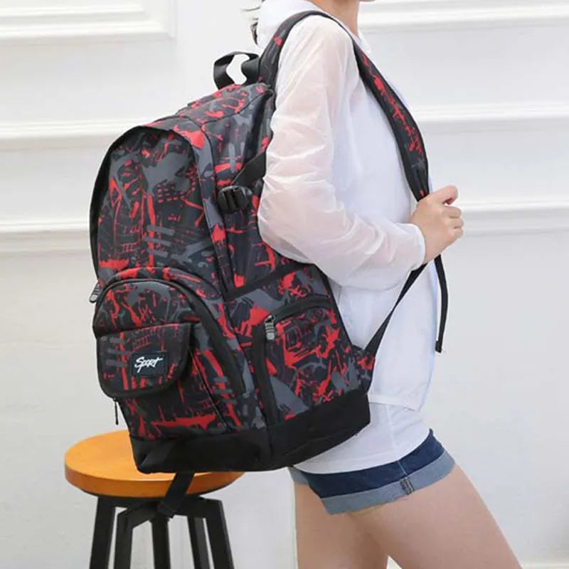 Blue and red large-capacity nylon backpack for school, travel, and outdoor activities.