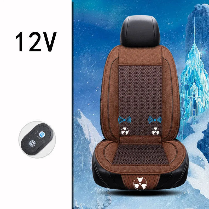 Square black car ventilation seat cushion on a car seat with a connected power cord.