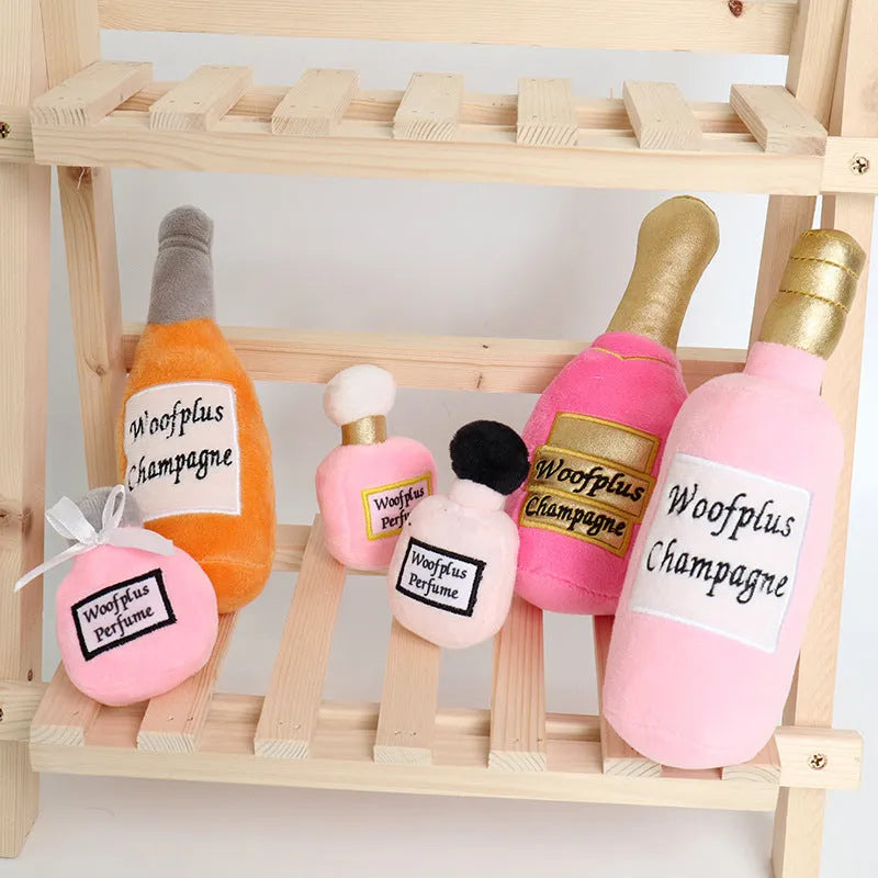 Plush wine bottle pet toy in assorted colours including green, orange, red, black and white.