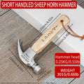 Mini claw hammer with wooden handle and high carbon steel head on a workbench