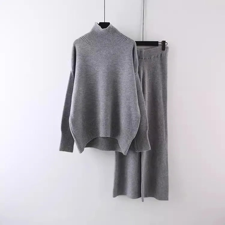 Women's casual two-piece set showing sweater and wide leg trousers in solid colour with thread detail