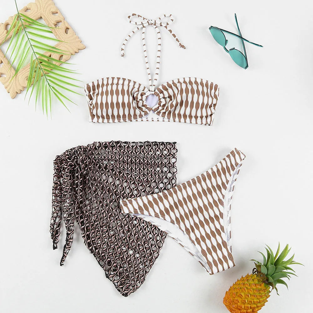 Women's striped three-piece swimsuit set with tube top, shorts, and waist skirt hem