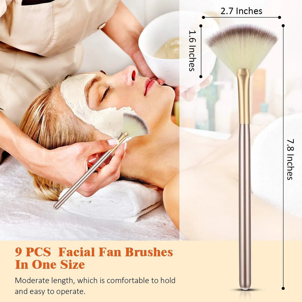 Ten champagne-coloured facial fan brushes with acrylic handles and protective covers.
