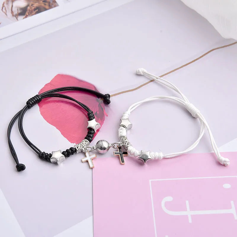 Magnetic clasp couple bracelets with alloy construction and symbolic designs including crown and love lock motifs.