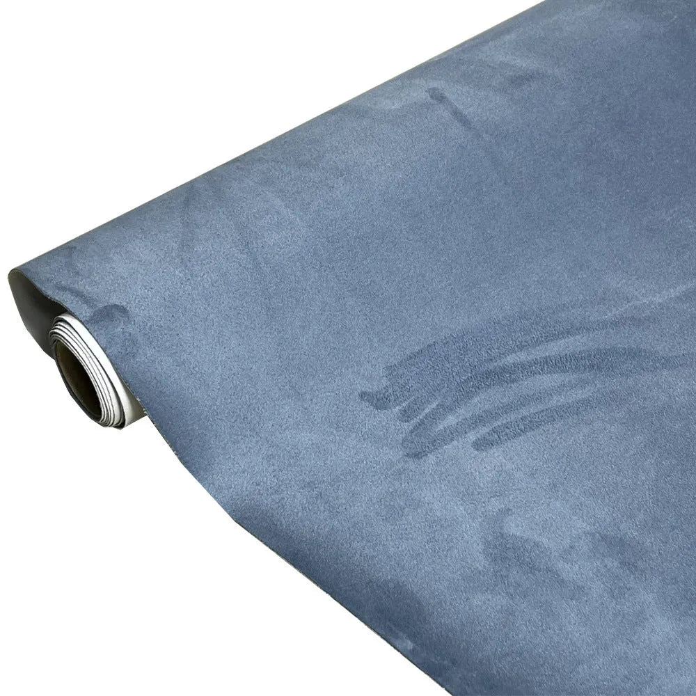 Rolls and sheets of coloured self-adhesive suede leather material for DIY projects.
