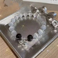 Glass butterfly bracelet for women with colour-coordinated beads in drop-shaped design