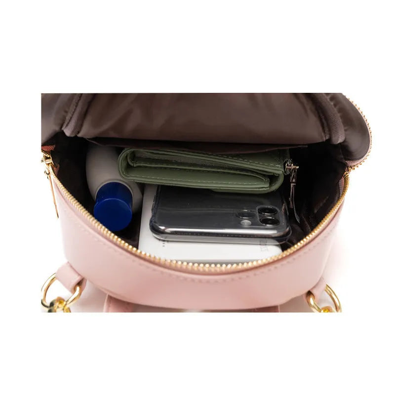 Soft PU mini backpack in street trend style with three-dimensional outer pocket, shown in one of six colour options.
