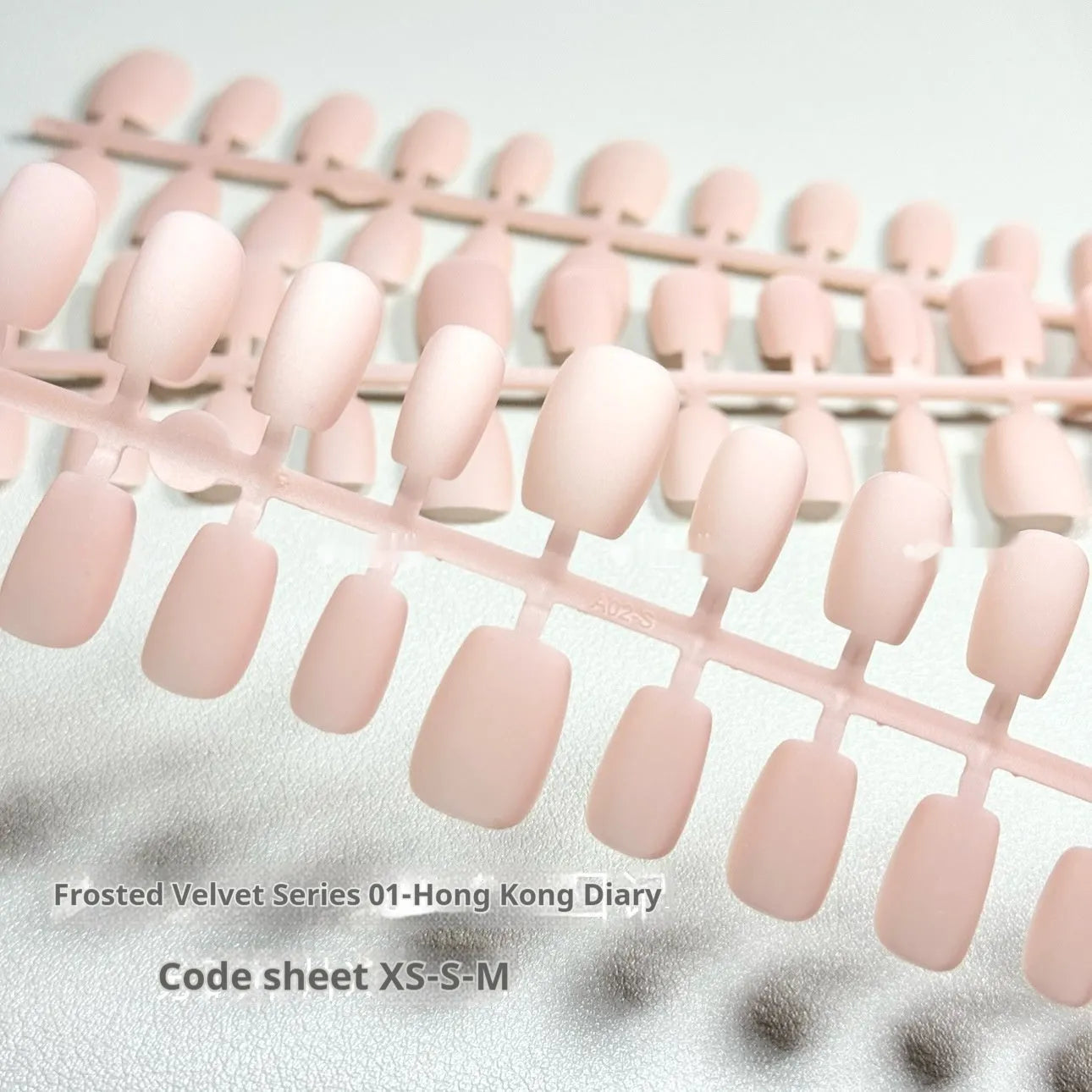 Set of frosted velvet Cat's Eye press-on false nails showing short ladder sizes XS, S, and M.